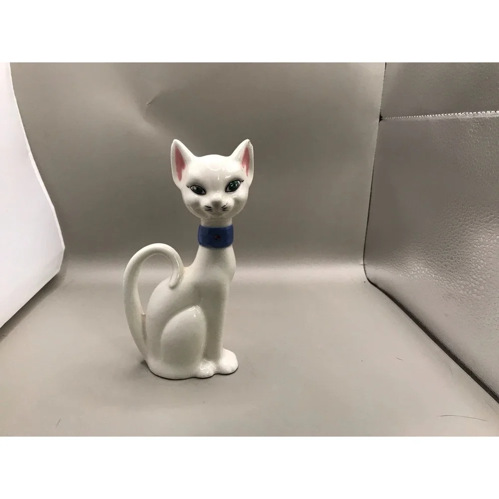 Pretty White Porcelain‎ Kitty With Green Eyes And A Blue Collar